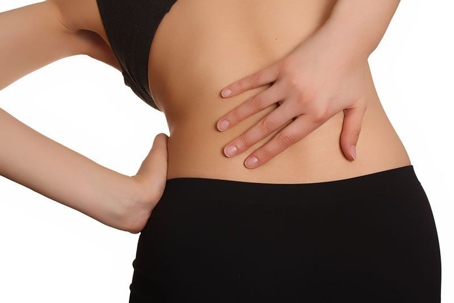 Person clutching back in pain