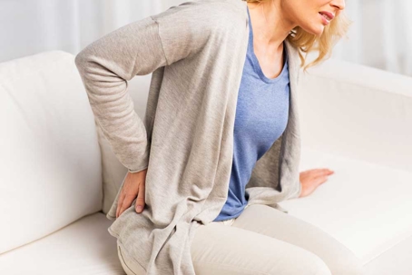 Woman suffering from a herniated disc