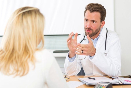 Orthopedic doctor talking to patient