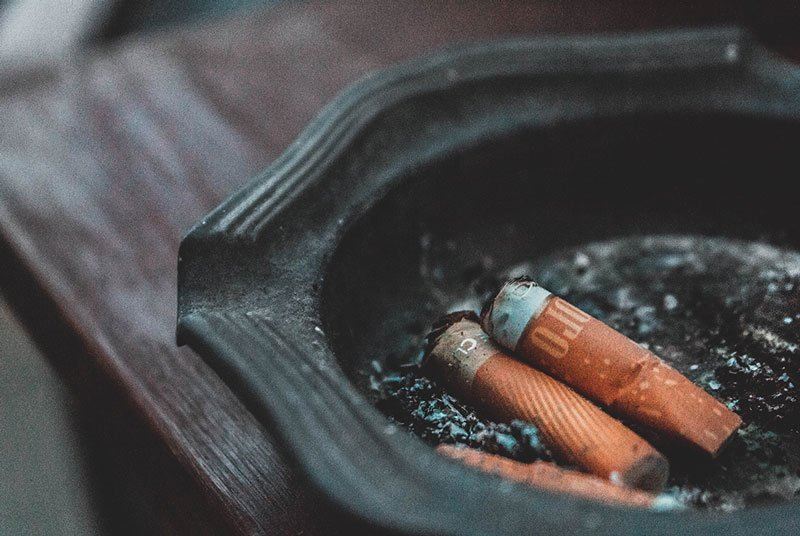 Cigarette butts in an ash tray
